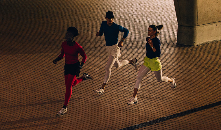 Two people run while wearing Apple Watch Series 11