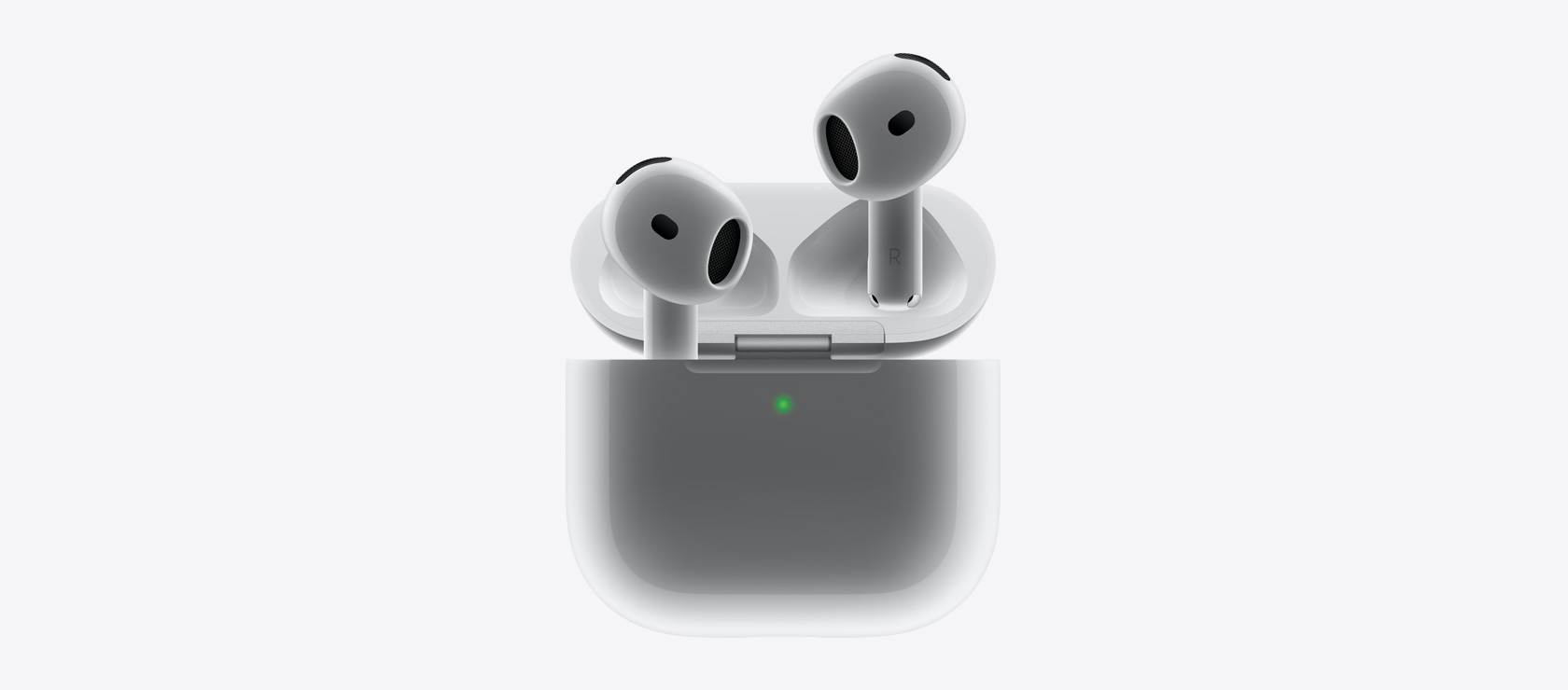 AirPods 4 w etui ładującym.