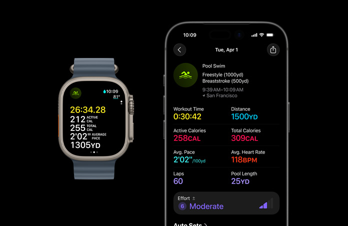 Apple Watch Ultra 3 med urkasse av naturlig titan og Ocean Band i ankerblå viser en aktiv svømmeøkt på skjermen. En større oversikt over treningsmålinger vises på iPhone.