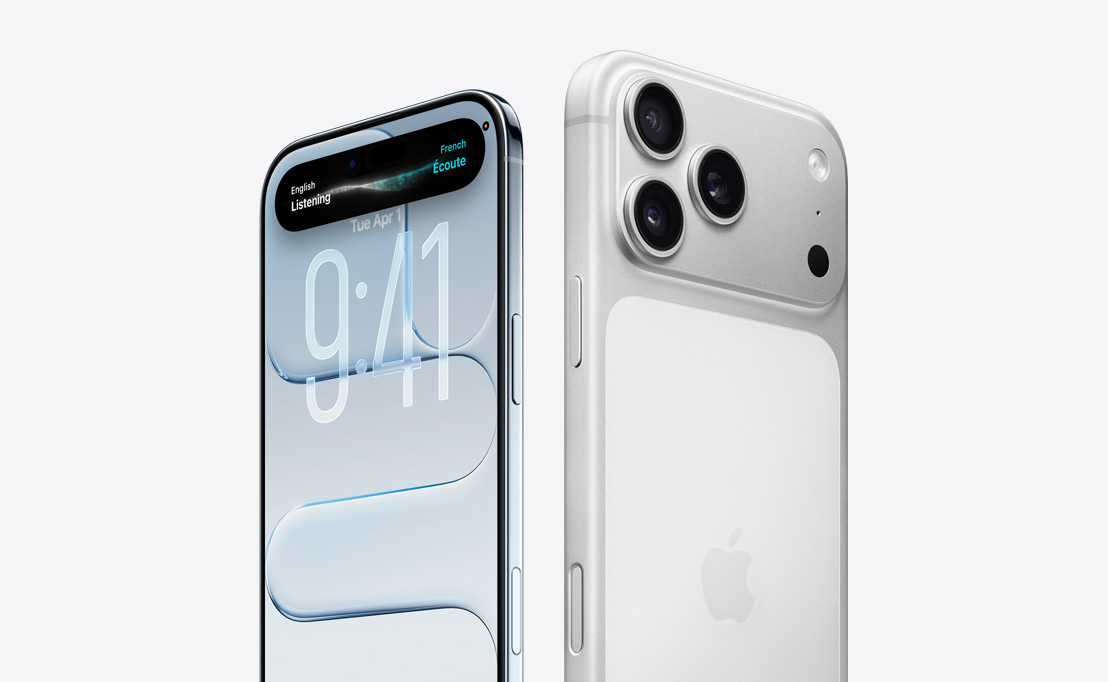 Zadní strana iPhonu 16 Pro z pouštního titanu, jsou vidět tři objektivy fotoaparátu za jiným iPhonem 16 Pro, na jehož obrazovce je vidět Dynamic Island.