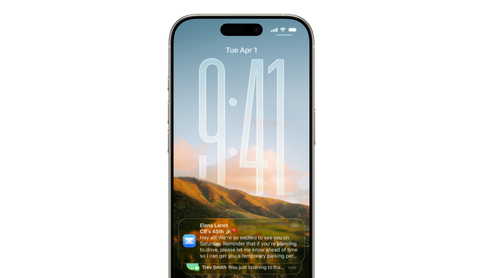 Écran verrouillé de l’iPhone avec photo, chiffres de l’heure en Liquid Glass, deux notifications apparaissent en bas de l’écran