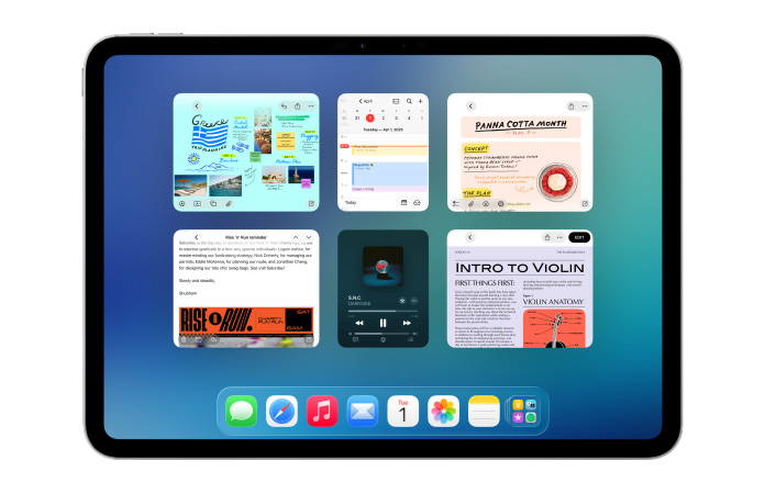 Un iPad, orientation paysage, l’écran affiche plusieurs apps comme Calendrier et Musique dans six fenêtres disposées équitablement sur deux rangées.
