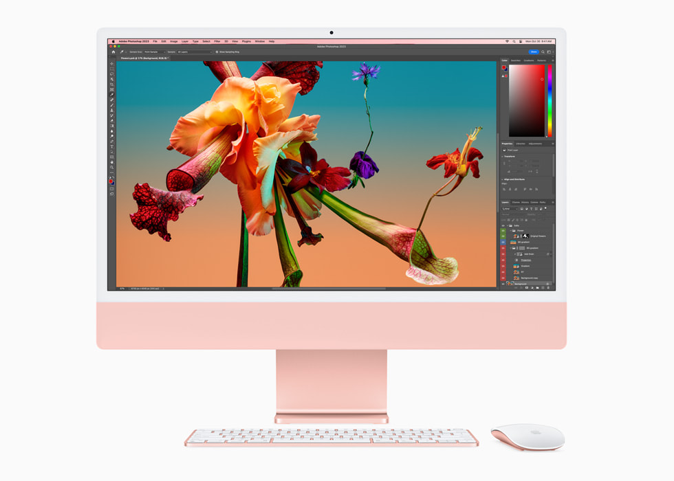 Adobe Photoshop vises på nye iMac med M3-chip i rosa med tastatur og mus i matchende farge.