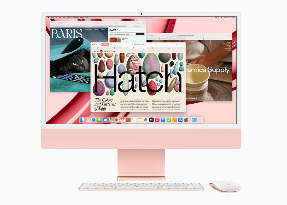 Safari vises på nye iMac med M3-chip i rosa med tastatur og mus i matchende farge.