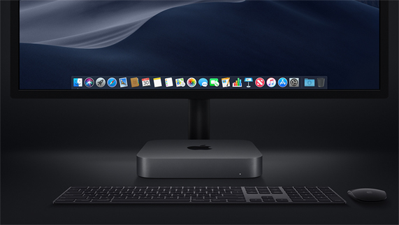 Mac mini photographié avec un Magic Keyboard, une Magic Mouse et un écran.
