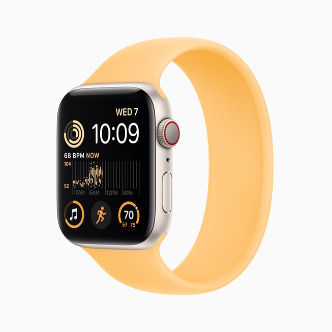 Nye Apple Watch SE av aluminum i stjerneskinn. 