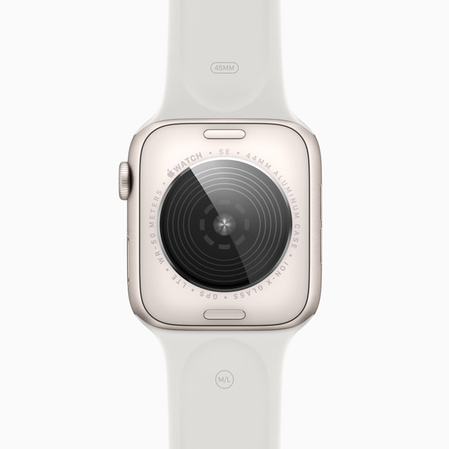 Den nydesignede, matchende baksiden til Apple Watch SE i stjerneskinn.