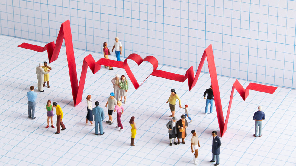 Illustrasjon av et stort grafikkbilde av et EKG-signal og en gruppe mennesker. 